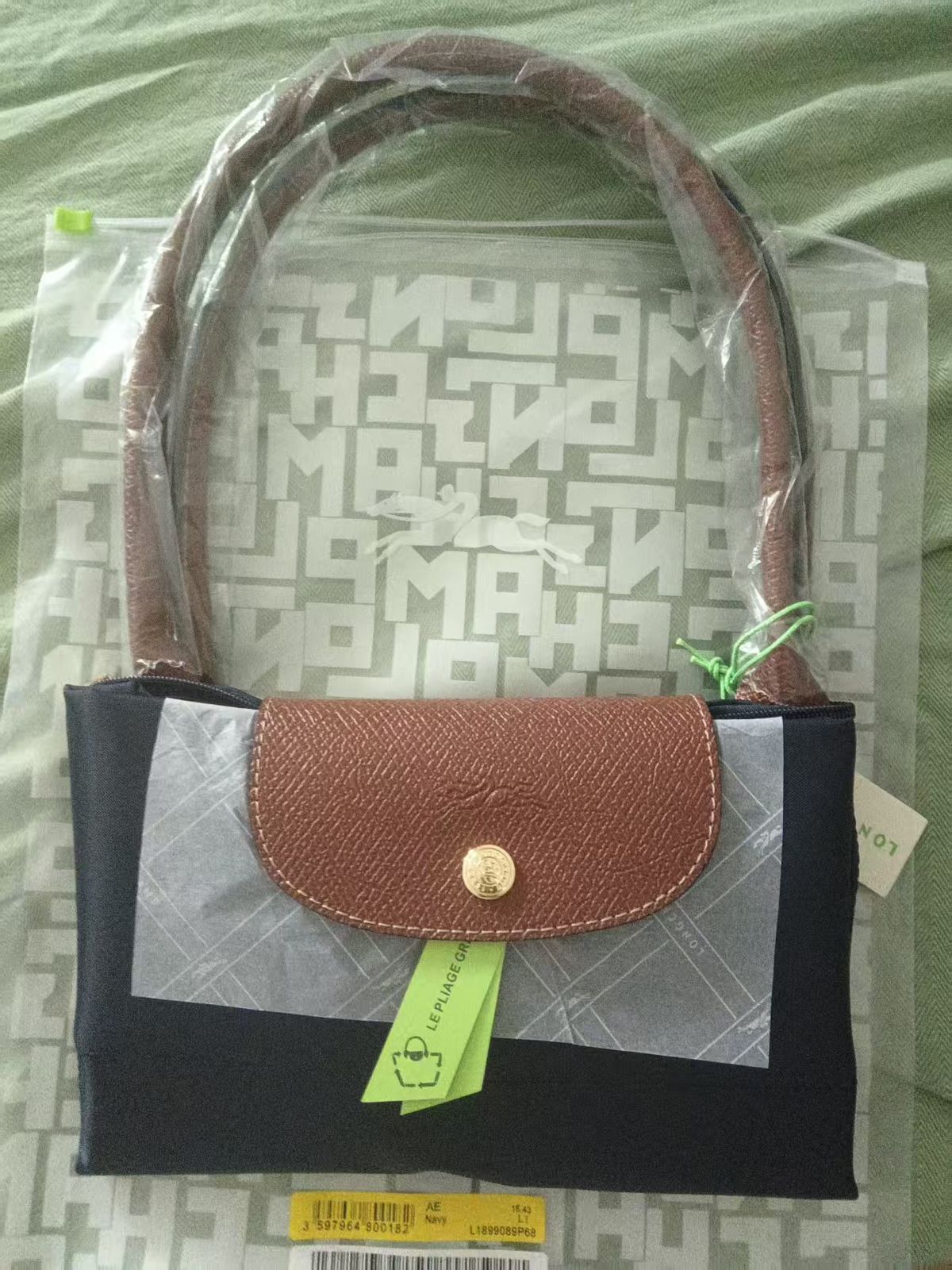 Compact handbag with leather accents