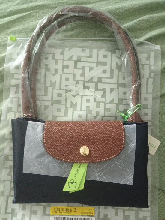 Compact handbag with leather accents