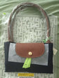 Compact handbag with leather accents Sheikhmarketplace